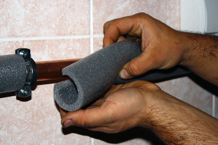 insulating pipes with foam insulation to keep them from freezing